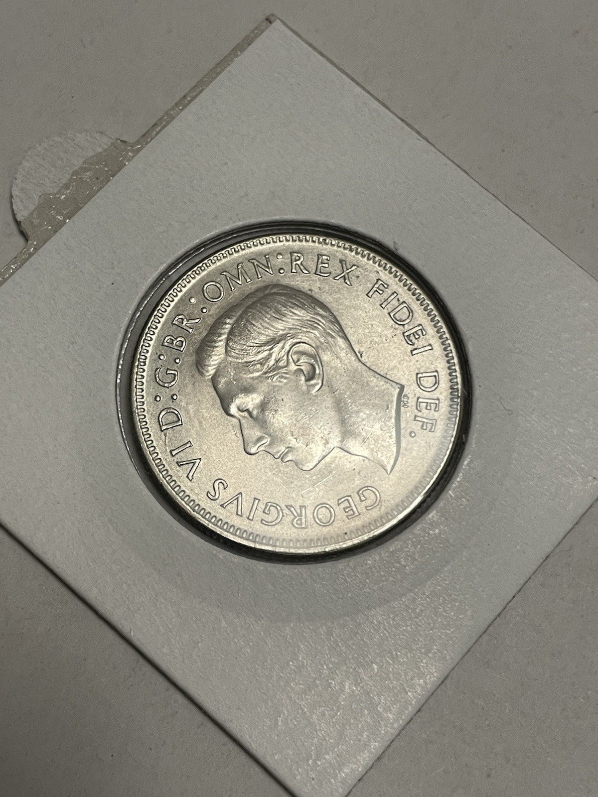 6957758