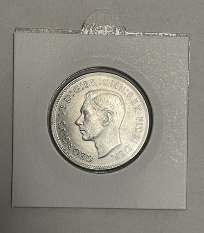 6957758
