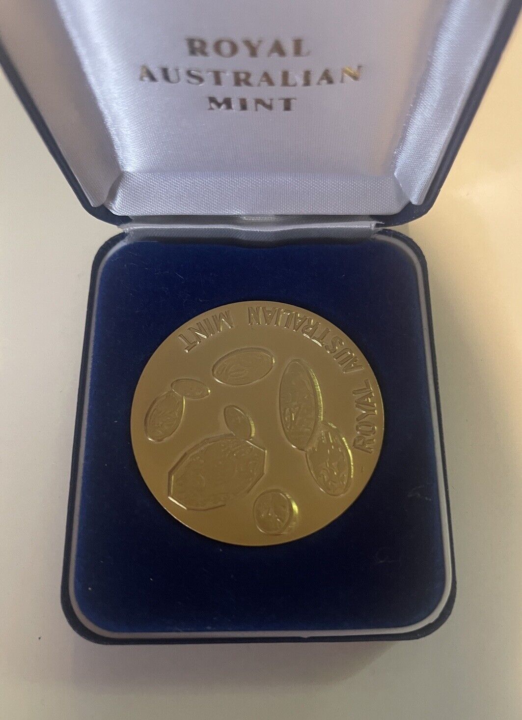 Royal Australian Mint medallion with Aboriginal Elder surrounded by Wildlife