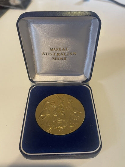 Royal Australian Mint medallion with Aboriginal Elder surrounded by Wildlife